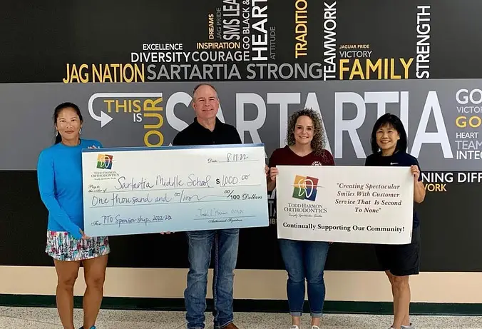Dr. Harmon donates $1000 to Sartartia Middle School